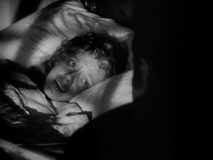Citizen Kane still: Susan Alexander Kane (Dorothy Comingore), post-suicide attempt.