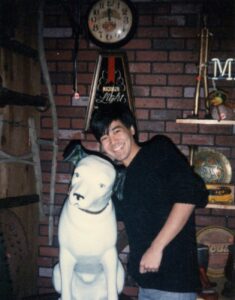 Corey Okada with statue of Nipper, the RCA Victor "His Master's Voice" dog.