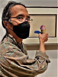 Corey Okada with Wayne Thiebaud's Strawberry Cone (1969) at Wayne Thiebaud: A Celebration, 1920-2021; Crocker Art Museum, Sacramento CA (2022).