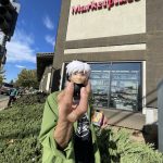 Corey Okada with kidrobot's Many Faces of Andy Warhol "Fright Wig 1980s" vinyl figure, an impulse buy from Oto's Marketplace, Sacramento, CA. Photo by L. Amir.